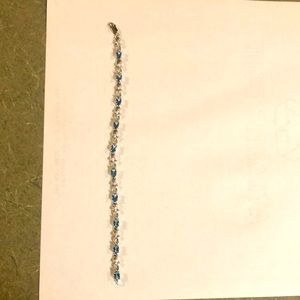 Blue topaz bracelet with diamond accents